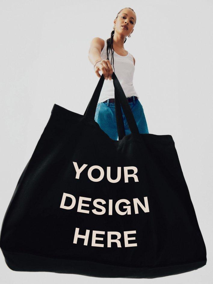 model holding tote bag